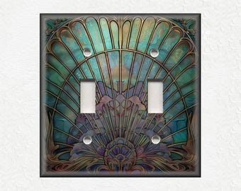 May include: A decorative light switch cover with a stained glass design featuring a teal, blue, and purple seashell pattern.