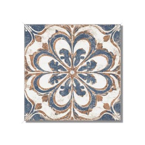 May include: A square ceramic tile with a blue and brown floral pattern. The tile has a distressed, vintage look.