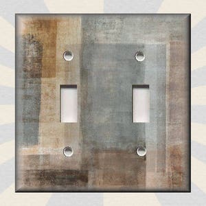 May include: A light switch cover with a textured abstract design in shades of brown, gray, and white.