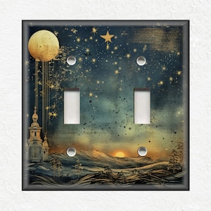 May include: A double light switch cover with a vintage-inspired design featuring a golden moon, stars, and a church silhouette against a blue and gold sky. The background has a textured, aged look.