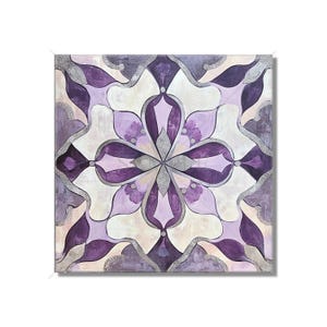 May include: A square canvas painting with a purple and silver geometric design. The design features a central flower with eight petals and a silver center. The background is a light beige color.