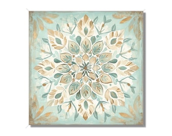 May include: A square canvas painting with a blue, green, and brown mandala design. The mandala is made up of intricate floral patterns and is surrounded by a light blue background.