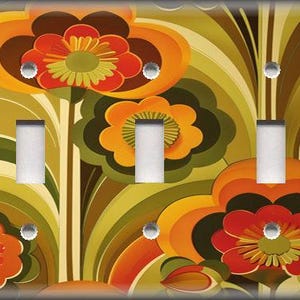 May include: A decorative light switch cover featuring a retro floral design in shades of orange, red, green, and brown. The cover has three light switch openings and silver screws.