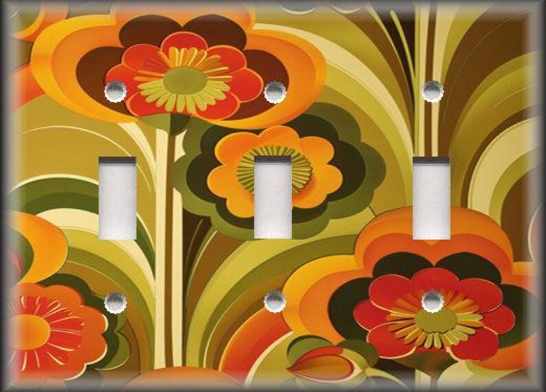 May include: A decorative light switch cover featuring a retro floral design in shades of orange, red, green, and brown. The cover has three light switch openings and silver screws.