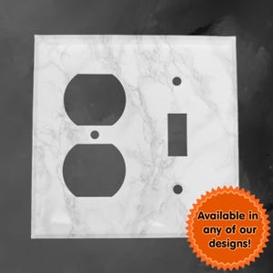 May include: White marble patterned wall plate with a single light switch and a double outlet. The plate is available in other designs.