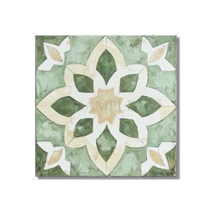 May include: Square decorative tile with a floral design. The tile features a central starburst pattern in cream and olive green, surrounded by a pale green background. Four smaller floral accents are in the corners. The artwork has a textured, painted appearance.