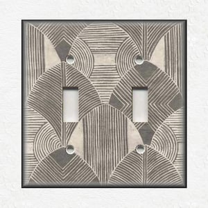 May include: A double light switch cover with a geometric pattern in shades of gray and white.