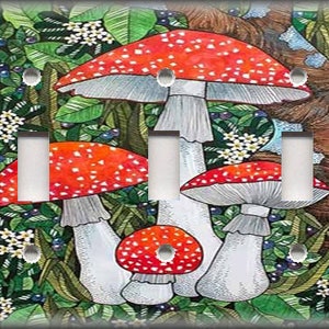 May include: A light switch plate featuring a whimsical illustration of red and white mushrooms growing in a lush green forest setting.