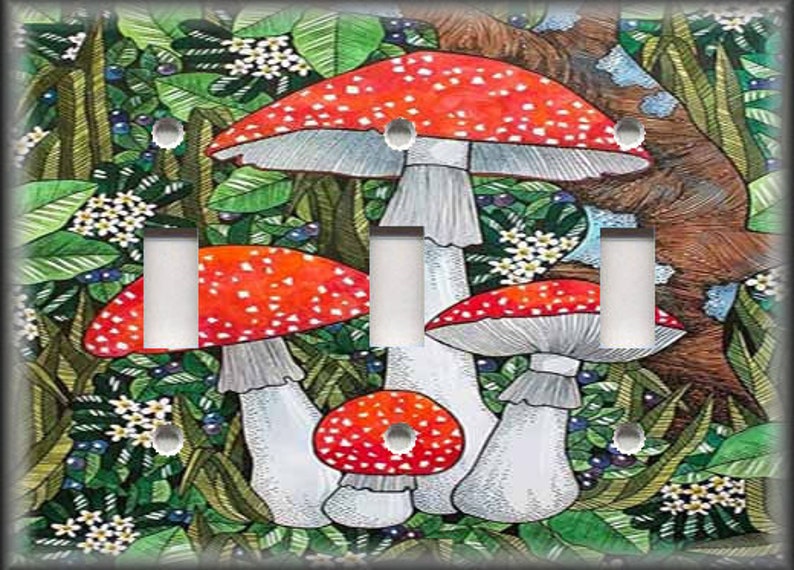 May include: A light switch plate featuring a whimsical illustration of red and white mushrooms growing in a lush green forest setting.