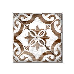May include: A brown and white square tile with a decorative floral pattern. The tile has a distressed, vintage look.
