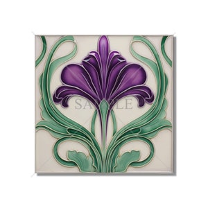 May include: A square ceramic tile with a purple flower design. The flower has a stylized, Art Nouveau look with green leaves and stems.