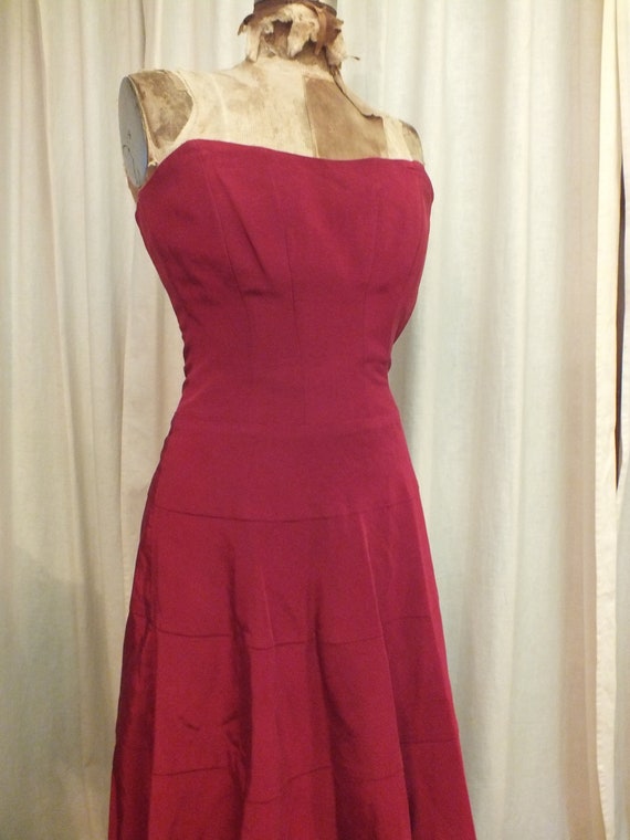 Strapless Dress in a Deep Red with Corset Style Back Size 2 Strapless Dress in a Deep Red with Corset Style Back Size 2