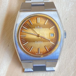 Vintage Levrette Automatic Wristwatch: Swiss Made, Gold Dial, Quickset Date