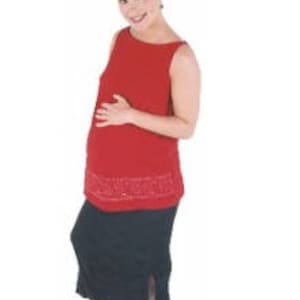 May include: A woman wearing a red sleeveless maternity top with a black skirt and black shoes.