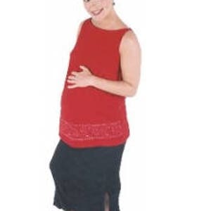 May include: A woman wearing a red sleeveless maternity top with a black skirt and black shoes.