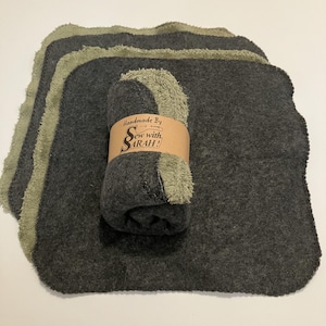 May include: Set of six gray and green dishcloths with a scalloped edge. The dishcloths are rolled up and tied with a brown paper band that says "Handmade By Sew with SARAH!"