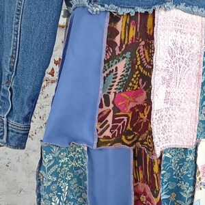 Close up of blue floral, pink and pink and brown fabric.