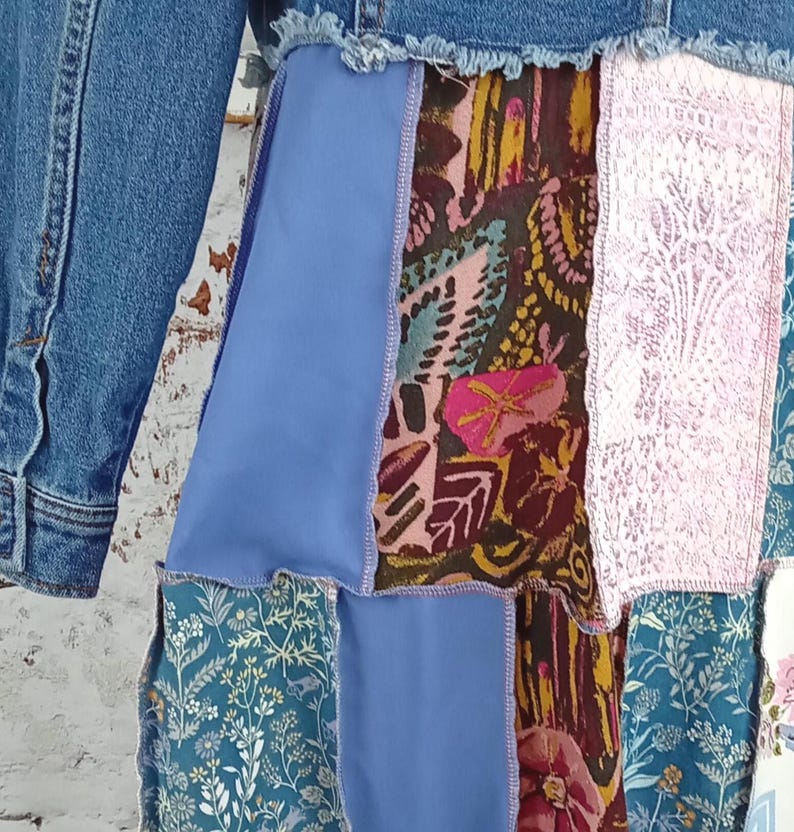 Close up of blue floral, pink and pink and brown fabric.