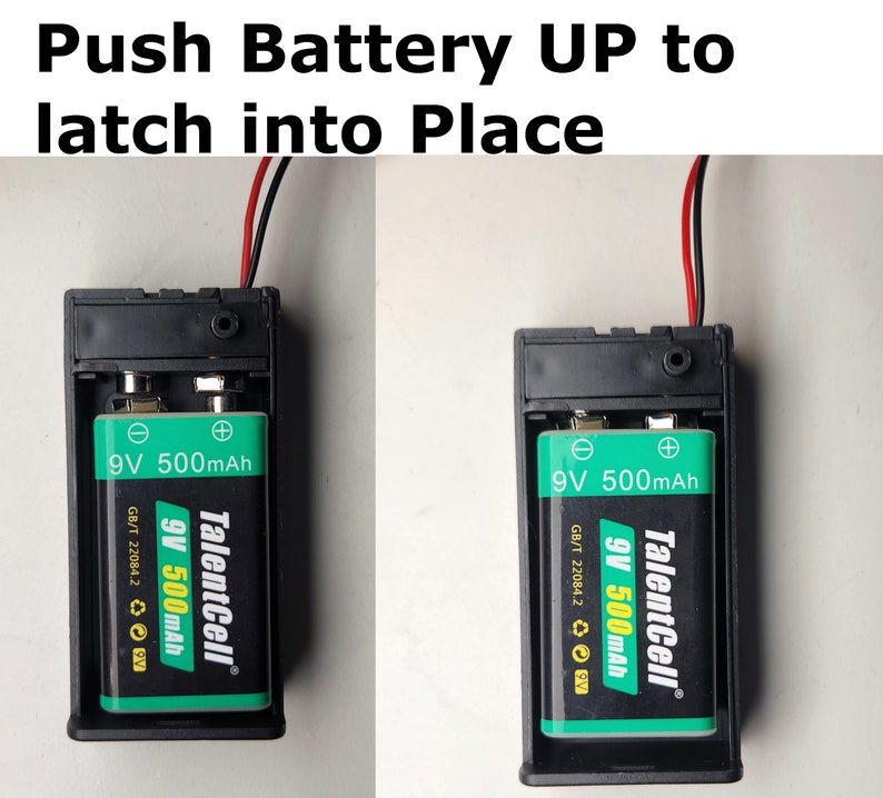 May include: Close-up of a black battery holder with a 9V battery inserted. The battery is green and black with the text "TalentCell 9V 500mAh" printed on it. The image shows the battery being pushed up into the holder to latch into place.