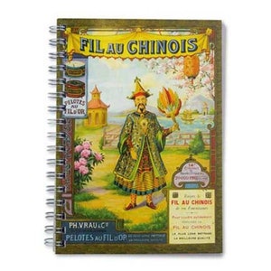 May include: A vintage-style notebook cover with a colorful illustration of a man in a traditional Chinese robe holding a fan. The cover features the text "FIL AU CHINOIS" and "PELOTES AU FILOOR".