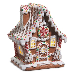 May include: A gingerbread house with white icing, colorful sprinkles, and a red and white peppermint candy. The house has lit windows and a chimney. A festive holiday decoration.
