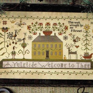 May include: A framed cross-stitch sampler with a yellow house, trees, and a reindeer. The text reads "This work wrought by me P.Stewart A Yuletide Welcome to Thee".