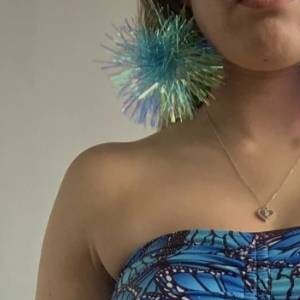 May include: A blue strapless top with a butterfly print. The top has a gathered detail at the bust and ties at the front.