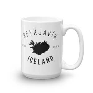 May include: White ceramic mug with a black graphic of the outline of Iceland and the text "REYKJAVIK" and "ICELAND" with the coordinates "64&deg; 08' N 21&deg; 56' W" underneath.