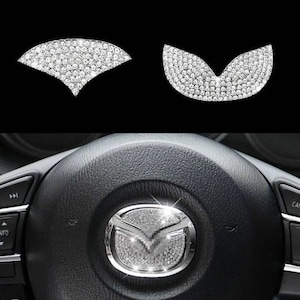 beautiful sparkling Mazda steering wheel emblem