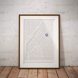 May include: A framed map of a city with a purple diamond marking a location. The map is titled "Dodger Field 34.05.48° N 118.24.55° W".