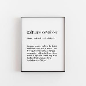 May include: A framed print with the words "software developer" in a minimalist black font. The definition includes the pronunciation and a description of the role, highlighting their work with code, systems, and problem-solving.