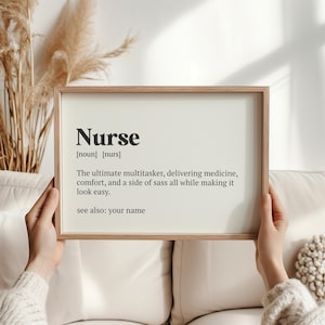 May include: A framed print with a white background and black text that reads "Nurse [noun] [nurs] The ultimate multitasker, delivering medicine, comfort, and a side of sass all while making it look easy. see also: your name"