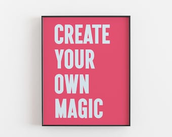 May include: A framed print with a pink background and white text that reads "CREATE YOUR OWN MAGIC".