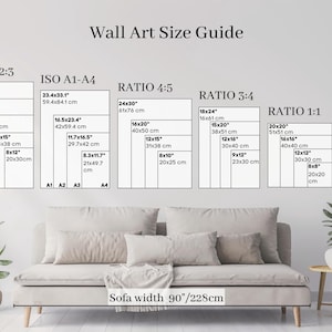 a living room with a couch and a wall size guide