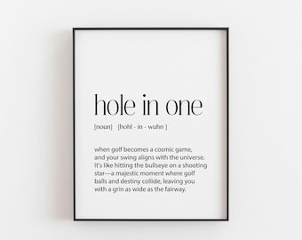 May include: Black and white printable art print with the definition of "hole in one" as a golf term. The definition reads: "when golf becomes a cosmic game, and your swing aligns with the universe. It's like hitting the bullseye on a shooting star - a majestic moment where golf balls and destiny collide, leaving you with a grin as wide as the fairway."