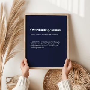 May include: A navy blue printable poster with the word "Overthinkopotamus" defined as "a person who overanalyses everything to the point of exhaustion, turning even the simplest decisions into a marathon of mental gymnastics."