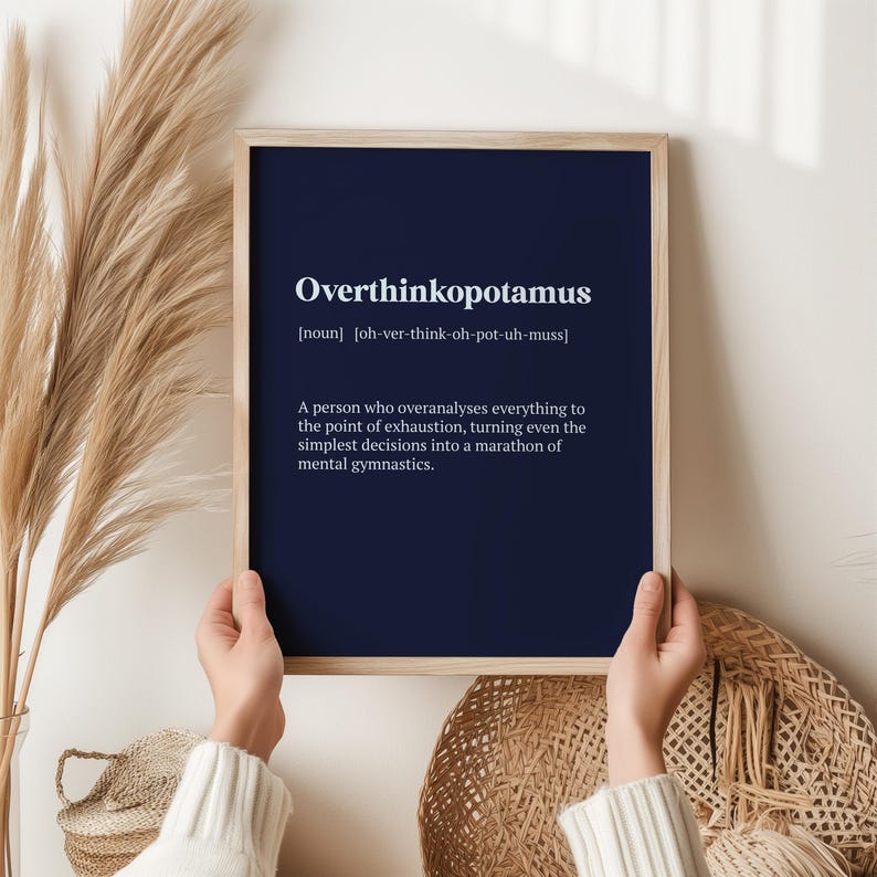 May include: A navy blue printable poster with the word "Overthinkopotamus" defined as "a person who overanalyses everything to the point of exhaustion, turning even the simplest decisions into a marathon of mental gymnastics."