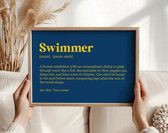 May include: A blue and yellow printable wall art print with the word "Swimmer" defined as a human amphibian with an extraordinary ability to glide through water like a fish. The definition also mentions goggles tan, damp hair, and a faint scent of chlorine. The print also says "see also: Your name".