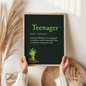 May include: A framed print with the word "Teenager" in green, and a definition. The definition reads: "A person infinitely better equipped to survive a zombie apocalypse than to study for tomorrow's exam." A green zombie hand is also featured.