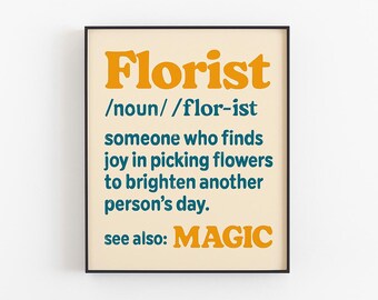 May include: A framed print with the word "Florist" in orange, above a definition in teal. The definition describes a florist as someone who finds joy in picking flowers to brighten another person's day. The phrase "see also: MAGIC" is at the bottom.