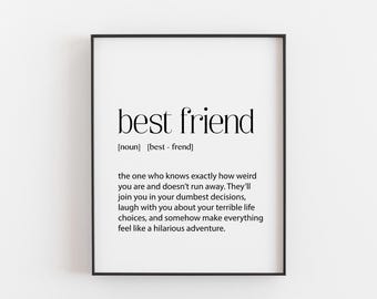 May include: A framed print with the words "best friend" in a black, minimalist font. The definition of "best friend" is written below, describing their role in your life. The frame is black, and the background is white.