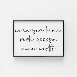 May include: Black and white framed print with the Italian phrase "mangia bene, ridi spesso, ama molto" which translates to "eat well, laugh often, love much".