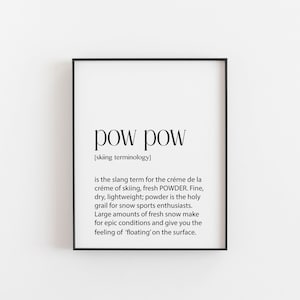May include: Black and white typography print with the word "pow pow" defined as the slang term for fresh powder snow in skiing. The print includes a description of the characteristics of powder snow and its appeal to skiers.