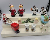 Noel Boy and Girl, Football Players, Santa in Boat, Mermaids, World, Coke Dispencer, Mickey Mouse and Telephone Salt and Pepper Sets.