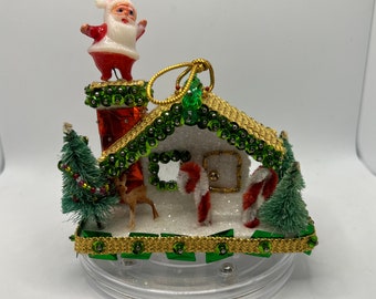 Kitsch Vintage Christmas Cottage with miniature Santa Christmas Ornament.