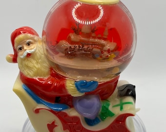 Vintage Rare Santa in Sleigh Holding a Large ornament Snowglobe.