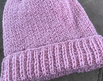 Girls pink hat hand knitted.