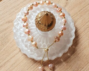 Justerbart armband med rosa pärlor