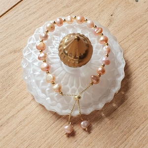 Adjustable pink beaded bracelet