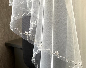 Wedding Veil For The Bride. The Border Of The Veil Is Embroidered With Beads And Crystals. The Veil Is Attached To The Сomb.